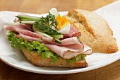 A ham, cucumber, egg and cress sandwich