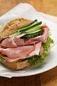 A mortadella and cucumber sandwich