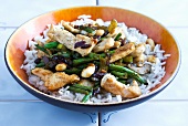 Chicken with green beans and almonds on a bed of rice