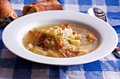 Cabbage and potato soup with bacon and caraway