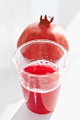 A pomegranate and pomegranate juice