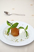 Poached pears with ice cream and mint