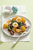 Potato salad with beans, egg and chorizo