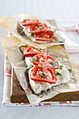 Oven-baked fish fillet with tomatoes and oregano
