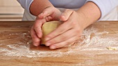 Shortcrust dough being shaped into a ball