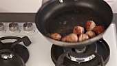 Meat balls being fried