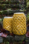 Lanterns made of preserving jars with crocheted covers