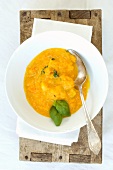 Pumpkin soup with basil (seen from above)