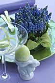 Grape hyacinths and Easter egg in egg cup