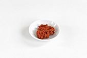 A bowl of red curry paste