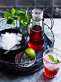 A strawberry drink with crushed ice and mint