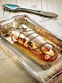 Baked hake filled with seafood (Spain)