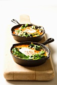 Shakshouka - poached eggs with tomatoes and spinach, Israel