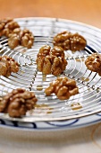 Caramelised walnuts on a wire rack