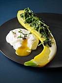 Yellow courgette with spinach and a poached egg