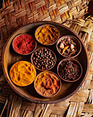 Bowls of various spices on a tray