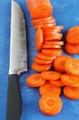 Sliced carrots and a knife