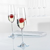 Champagne and raspberries in glasses