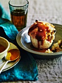 Suet pudding with an apple filling and caramel sauce