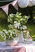 Flower arrangements on garden table
