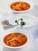 Red lentil soup with tomatoes, potatoes and sour cream