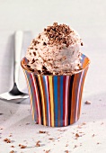 Chocolate ice cream in a stripy cup