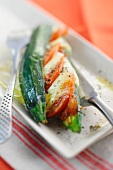 A courgette filled with tomato and mozzarella