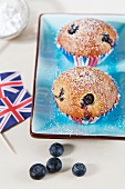 Blueberry muffins next to Union Jacks