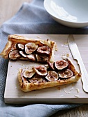 A fig tart, halved