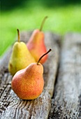 Three pears on a wooden board