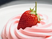 A fresh strawberry in strawberry mousse (close-up)