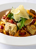 Tagliatelle with artichokes, tomatoes, rocket and Parmesan