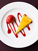 A slice of lemon tart with raspberry ice cream