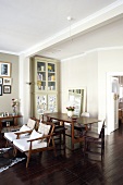 Open-plan living-dining room with dark table and seating