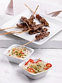 Beef kebabs with peanut sauce and bean sprout salad