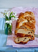 A bread plait with raisins and slivered almonds for Easter