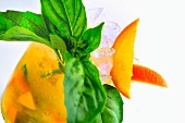 A basil and orange mojito (close-up)
