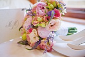 Bridal bouquet, white shoes and invitation card