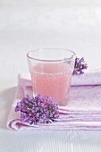 A juice spritzer in a glass with flowers