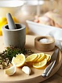 Lemon sliced, garlic, thyme and salt