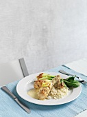 Marinated chicken legs with a creamy sauce and rice