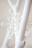 White-painted twigs and star-shaped ornament