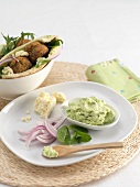 Avocado spread with mint and peas and falafel