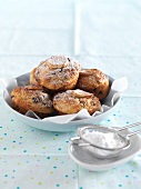 Banana and pecan muffins with chocolate chips and icing sugar