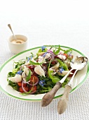 Rocket salad with smoked fish and borage flowers