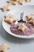 Star-shaped butter biscuits with pink sugar