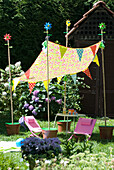 Colorful garden party decoration with pennant chain and awning