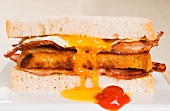 A toasted bacon, fried egg and cheese sandwich
