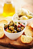 Grilled olives and artichokes with white bread (Spain)