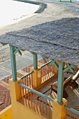 Roofed terrace, beach and ocean